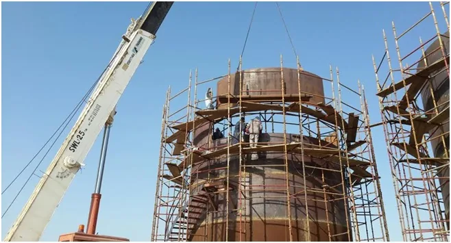 Four palm oil storage tanks — fabrication and installation.