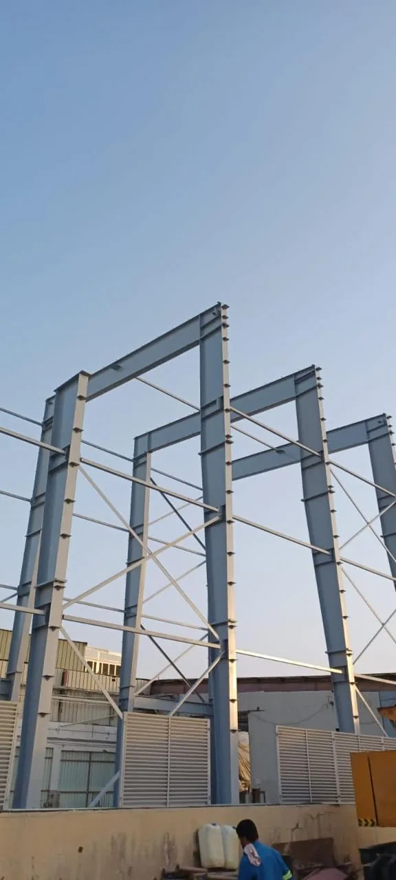 Steel portal frame erection.