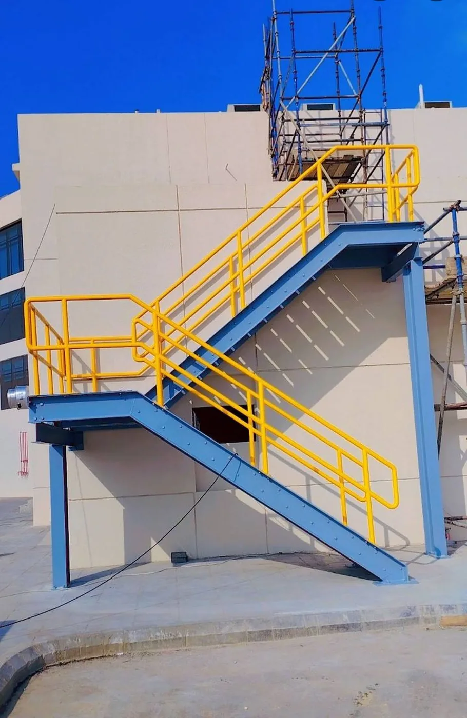 External steel staircase and access platform.