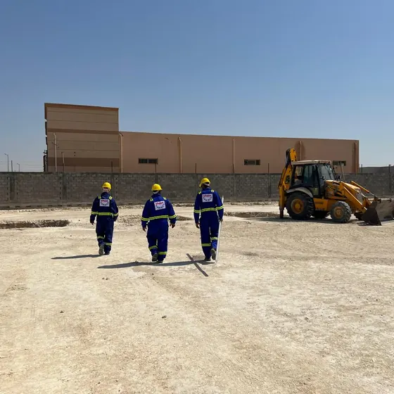 Site crew and earthmoving plant at work.
