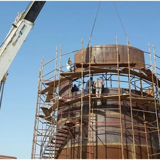 Four palm oil storage tanks — fabrication and installation.