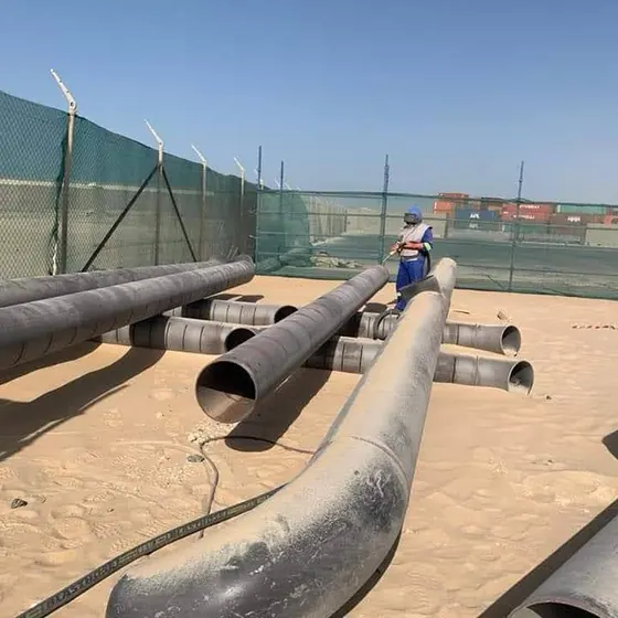 Fabricated pipe spools staged for installation.