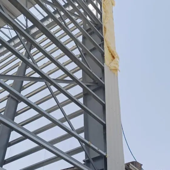 Steel structure erection on an industrial building.